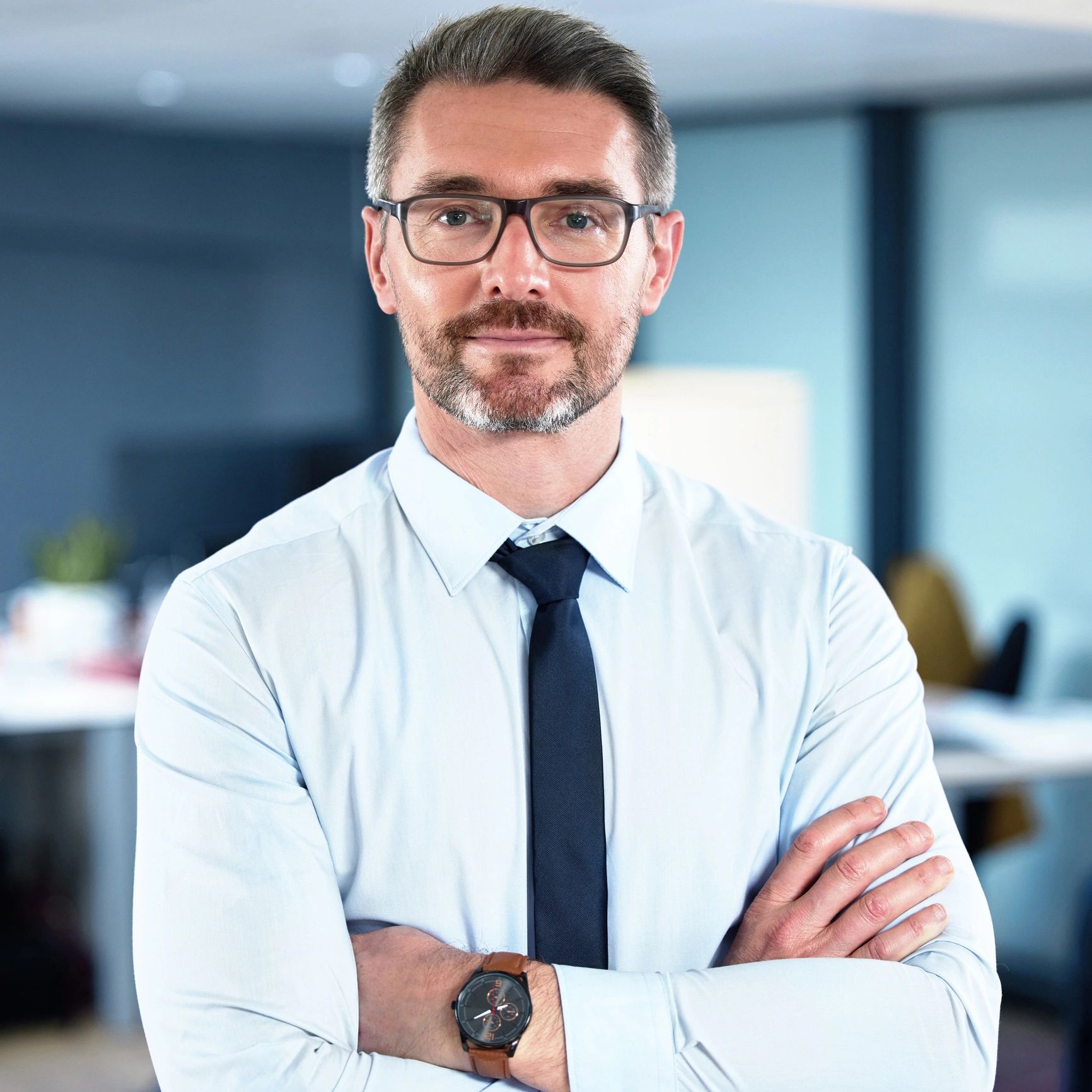 Professional headshot of a businessman in an office