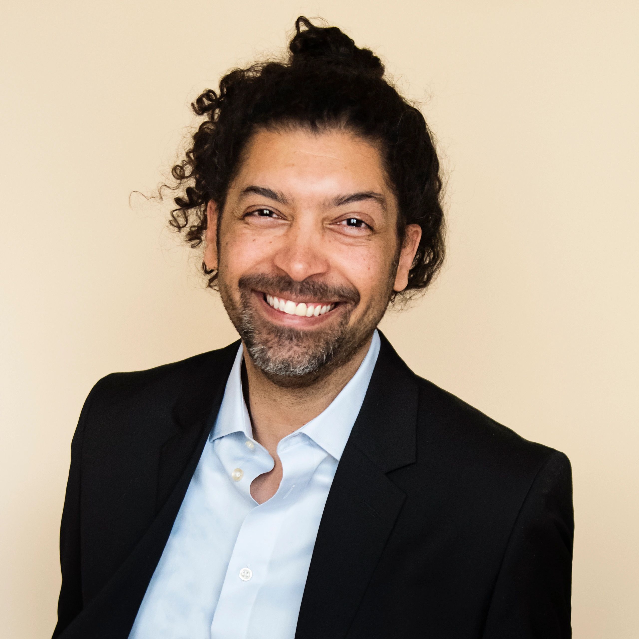 Professional headshot of a multiracial business professional