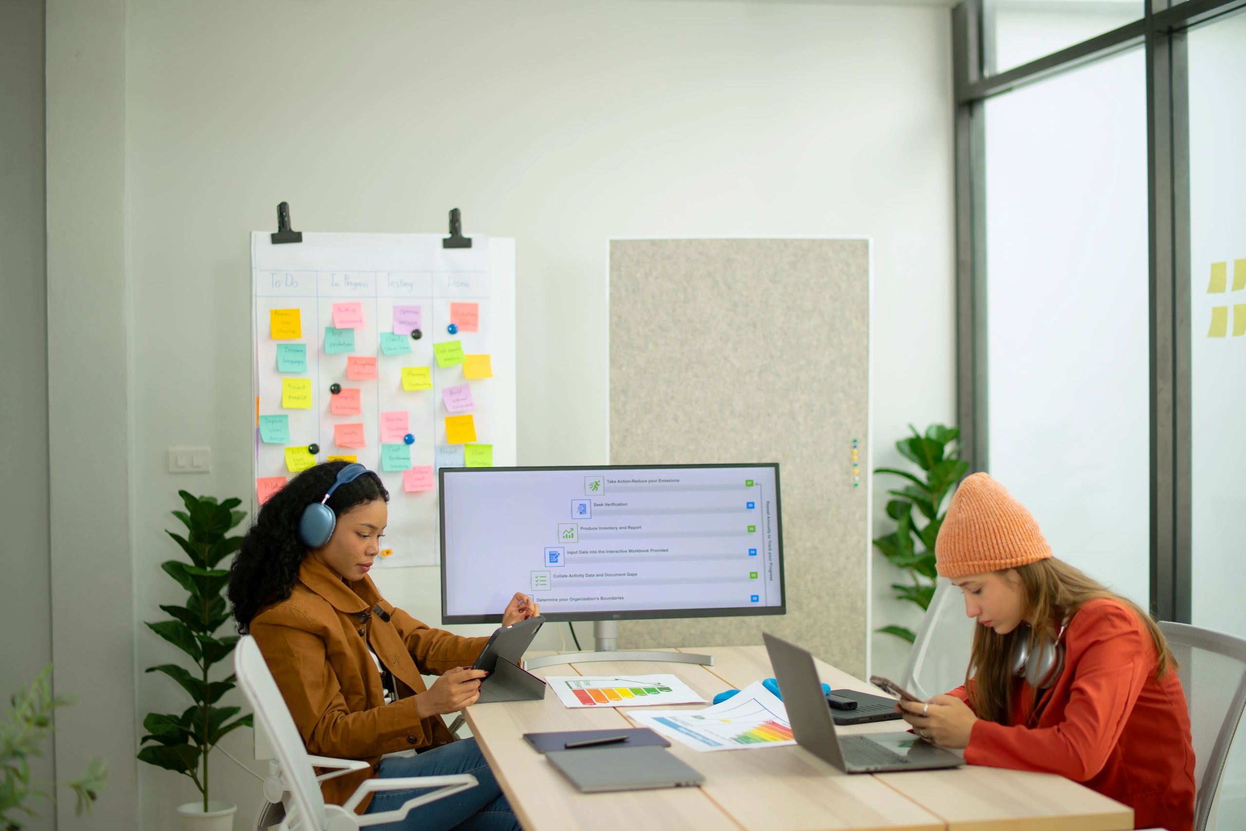 Team reviewing work in a workshop setting